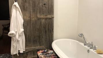 Bathtub, hair dryer, towels, soap