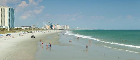 On the beach, sun loungers, beach towels