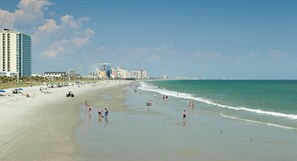On the beach, sun loungers, beach towels