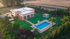 A large house with a swimming pool, a patio, and a fenced yard. - The Lemon Tree (Ainjohra)