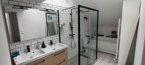 Combined shower/tub, hair dryer, towels, toilet paper