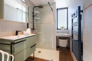 Shower, hair dryer, towels, toilet paper