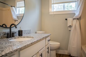 Shower, hair dryer, towels, toilet paper