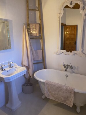 A bathroom with a white sink, a bathtub, and a mirror with an ornate frame. - <br>CASA LIMON - Family Villa with private pool (Moraira)