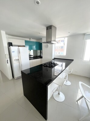 Fridge, microwave, stovetop, coffee/tea maker