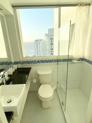 Shower, hair dryer, towels, soap