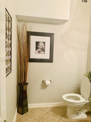 Combined shower/bathtub, towels, toilet paper