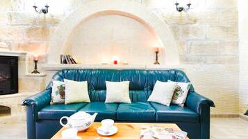 Villa, 3 Bedrooms, Pool View | Living room | LCD TV, fireplace