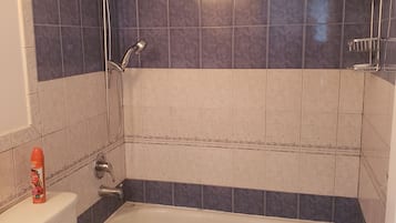 Bathtub, hair dryer, towels, soap