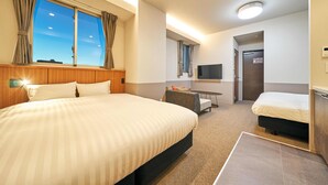 A hotel room with a large bed, a smaller bed, a desk, a TV, and a bathroom door. - Rakuten STAY Naha Yachimun Street (Naha)