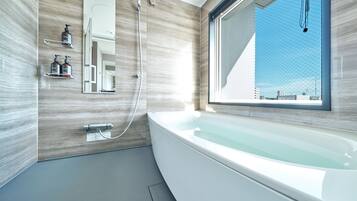 Separate bathtub and shower, hair dryer, bidet, towels
