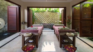 A spa room with two beds, a wooden ceiling, and a view of greenery outside. - Kaba Kaba Estate (Cepaka)