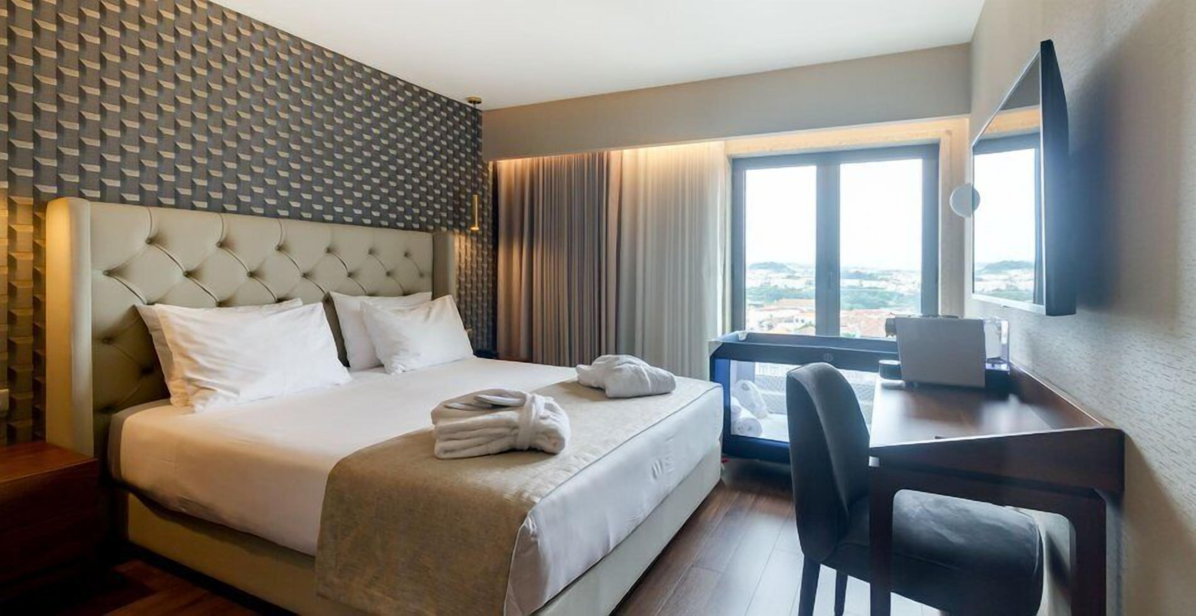 Minibar, desk, bed sheets