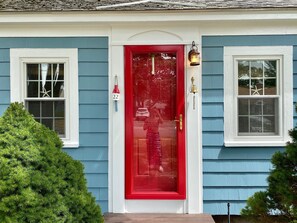 A house with a red front door, a number 22 sign, and a small porch. - Walk to the Beach! (Dennis Port)
