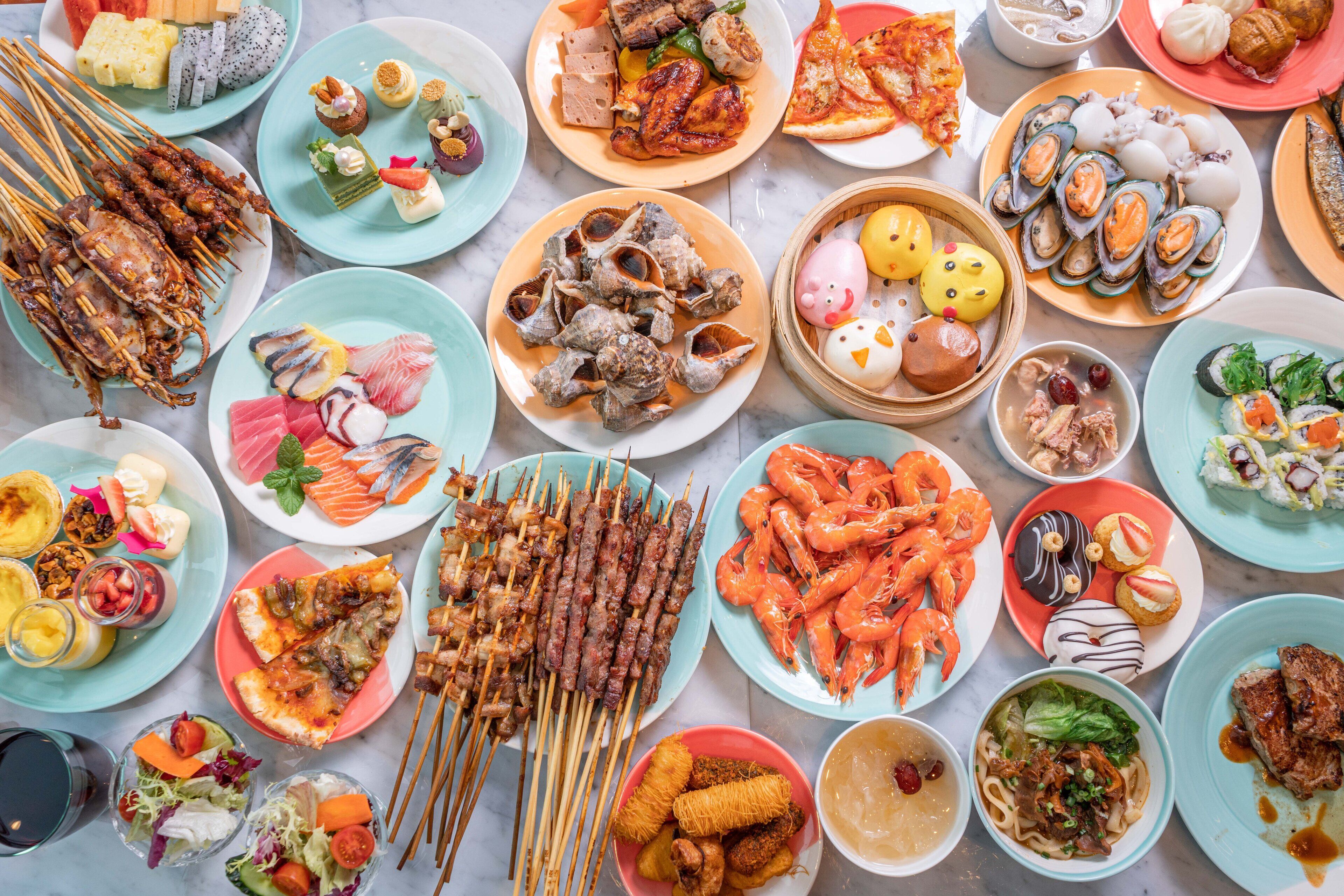A variety of dishes including seafood, skewers, and dumplings.