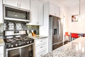 Microwave, dishwasher, coffee/tea maker, cookware/dishes/utensils