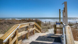 A wooden boardwalk leading to a beach with a clear view of the ocean. - Waterpointe II 806-3BR/2BA Oceanfront Condo in Windy Hill (North Myrtle Beach)