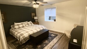 A bedroom with a bed, a ceiling fan, a window, and a dresser. - Welcome to CoCo Ranch Mtn Stay – Your Private Teton Valley Escape! (Victor)