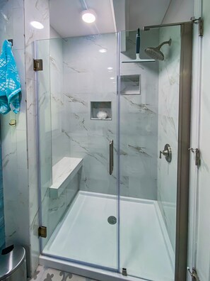 Shower, hair dryer, towels, toilet paper