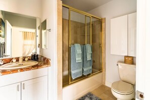 Combined shower/tub, hair dryer, towels, soap