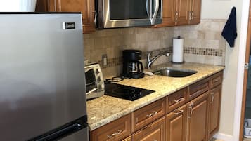 Fridge, microwave, stovetop, coffee/tea maker