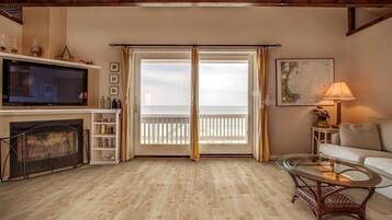 Smart TV, fireplace, books, offices
