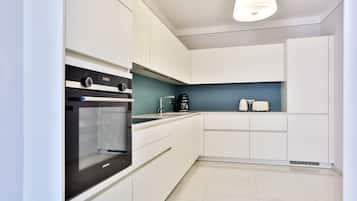 Fridge, microwave, cookware/dishes/utensils