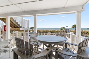Outdoor dining - "Waters Edge 429-D" - Oceanfront Condo w/ Community Pool, 2 Bedrooms / 2 Bathrooms (Holden Beach)