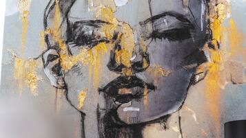 A painting with abstract elements and a neutral background.