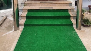 The entrance to a building with a sign reading "BIGSO STAY" and a logo above the entrance. - Bigso stay (Yangyang)