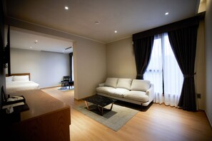 Suite Prestige | Aire de séjour | Téléviseur à écran plat