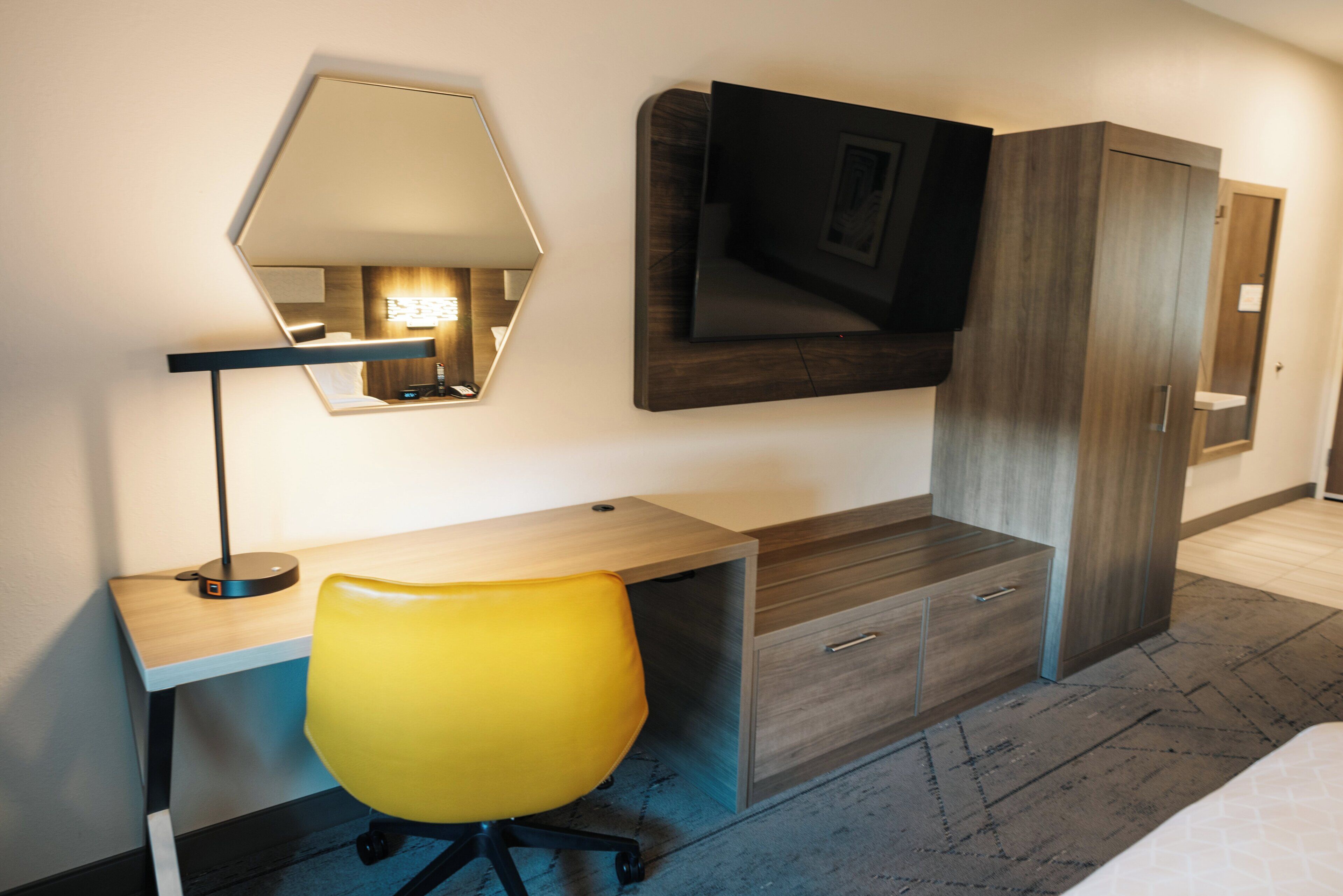 desk, laptop workspace, bed sheets