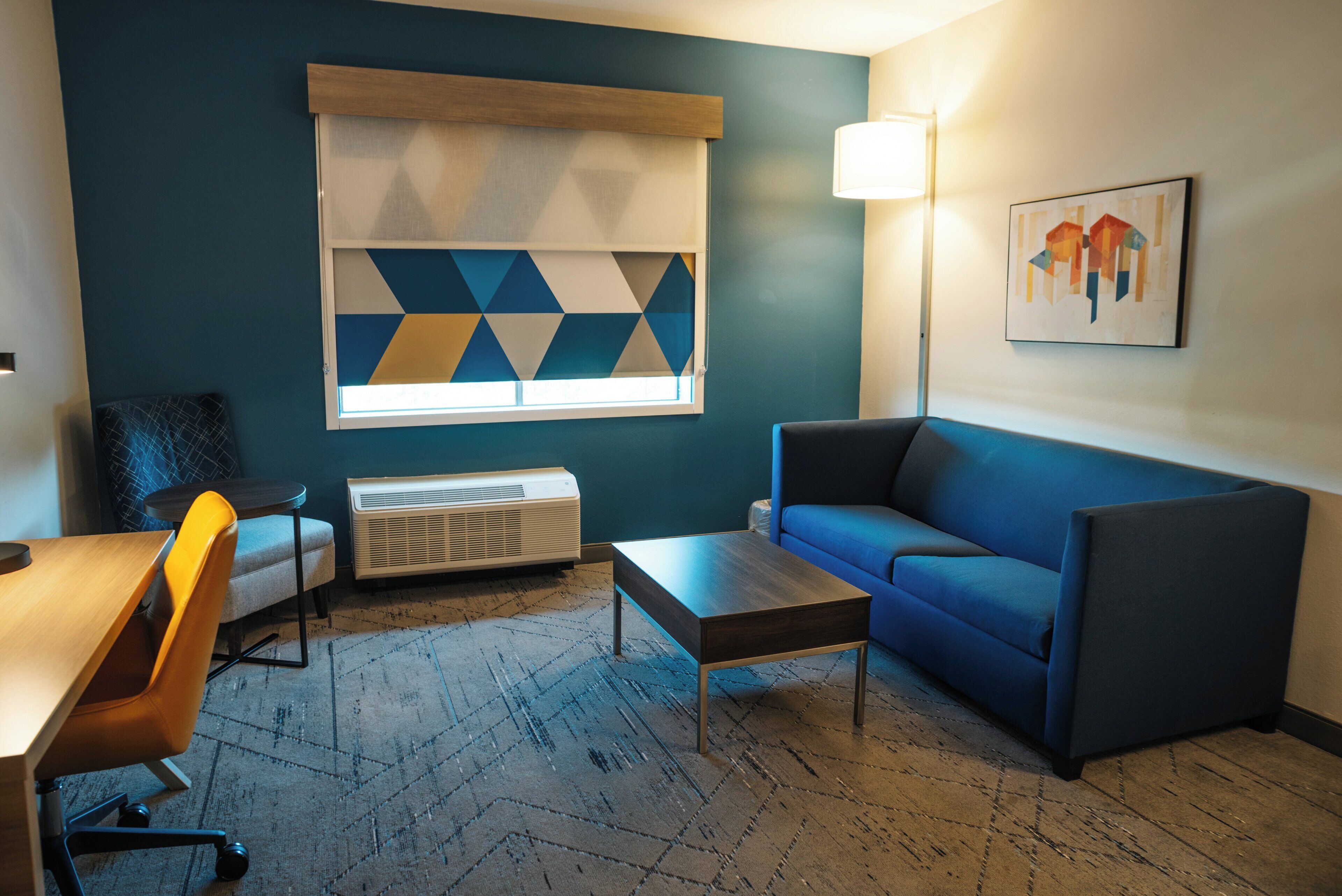 desk, laptop workspace, bed sheets