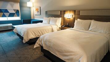 Desk, laptop workspace, bed sheets