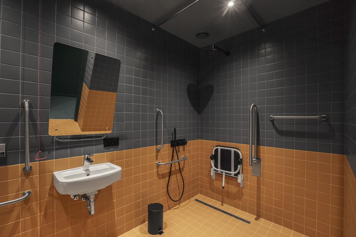 twin - disability access | bathroom | rainfall showerhead, eco-friendly toiletries, hair dryer, bathrobes