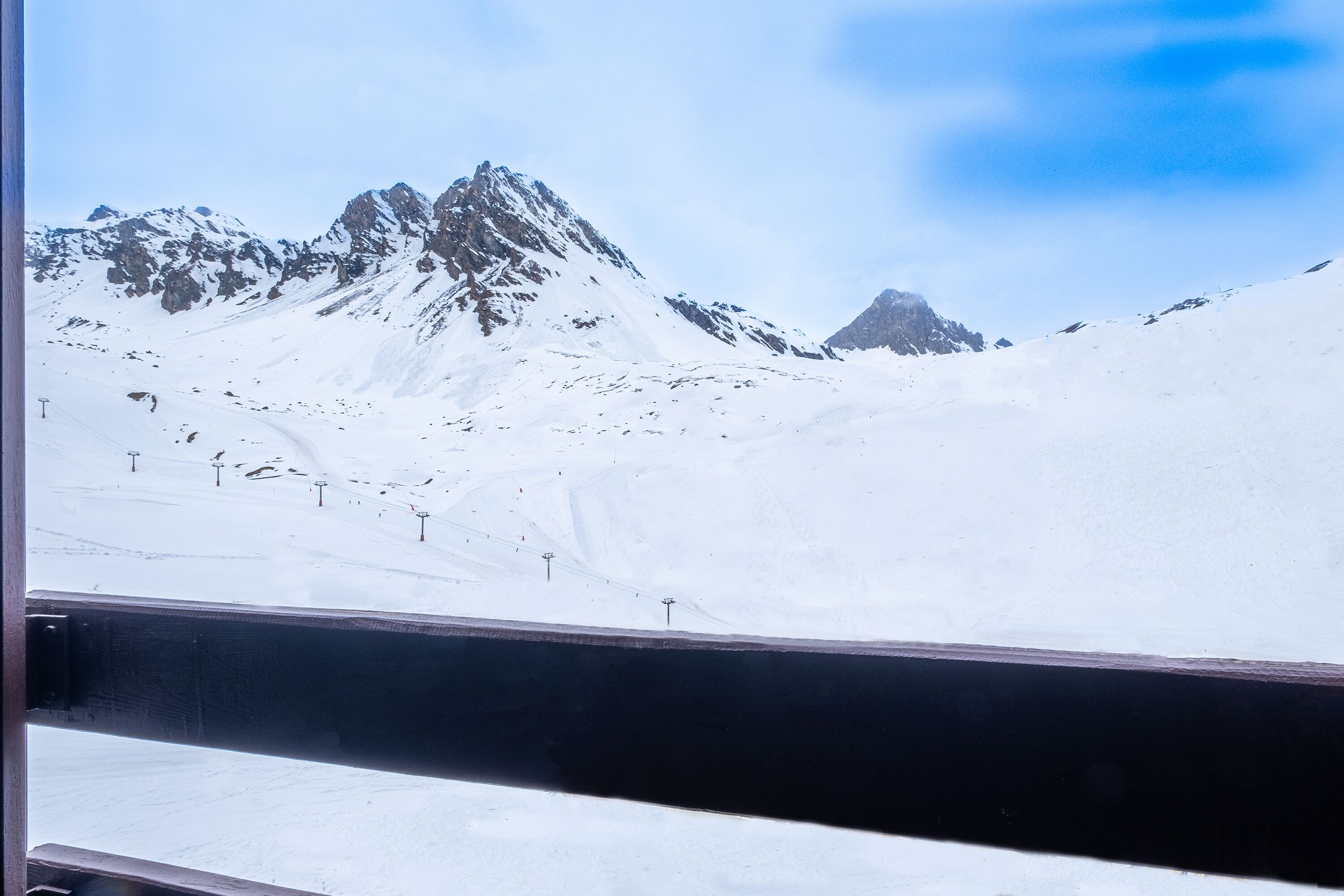 A snowy mountain landscape with a clear sky.