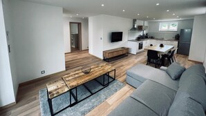A modern apartment with a living room, dining area, and kitchen. - RANDOM LISTING (Wintzenheim)