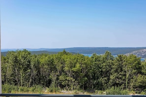 A forested landscape with a clear sky.