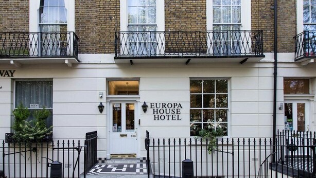 A two-story building with a sign for Europa House Hotel. - Europa House (London)