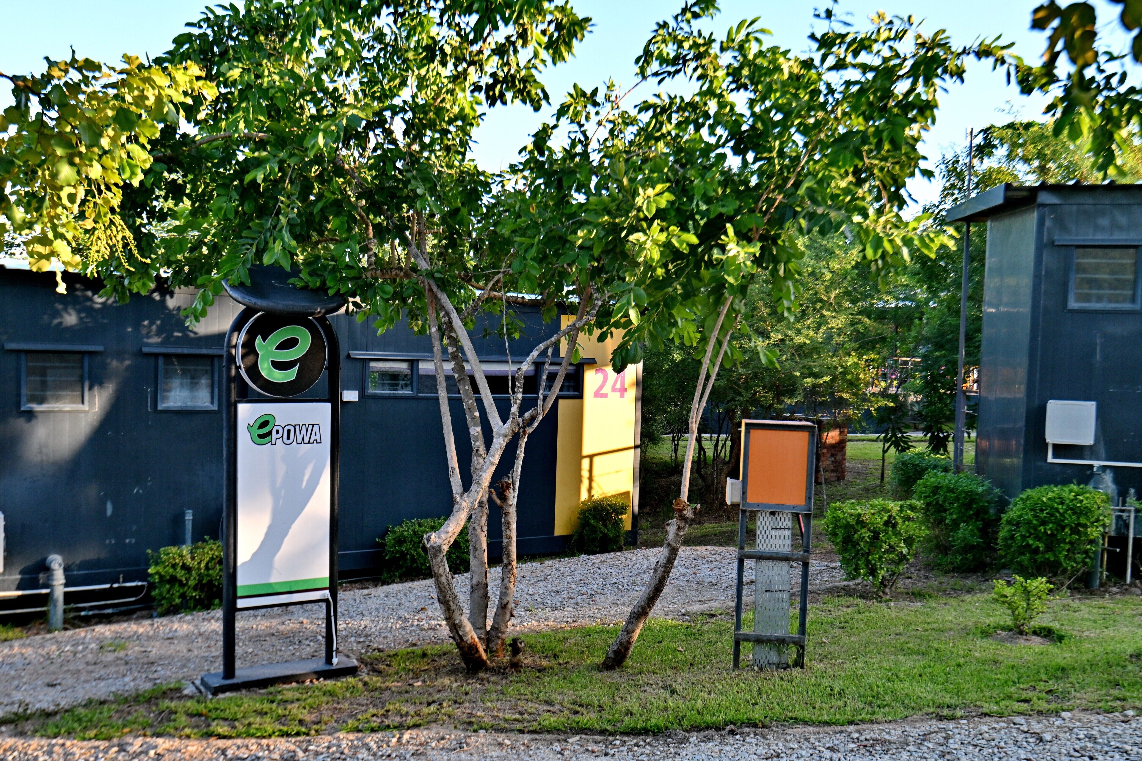 A sign with the logo 'ePOWA' and a building number '24'.