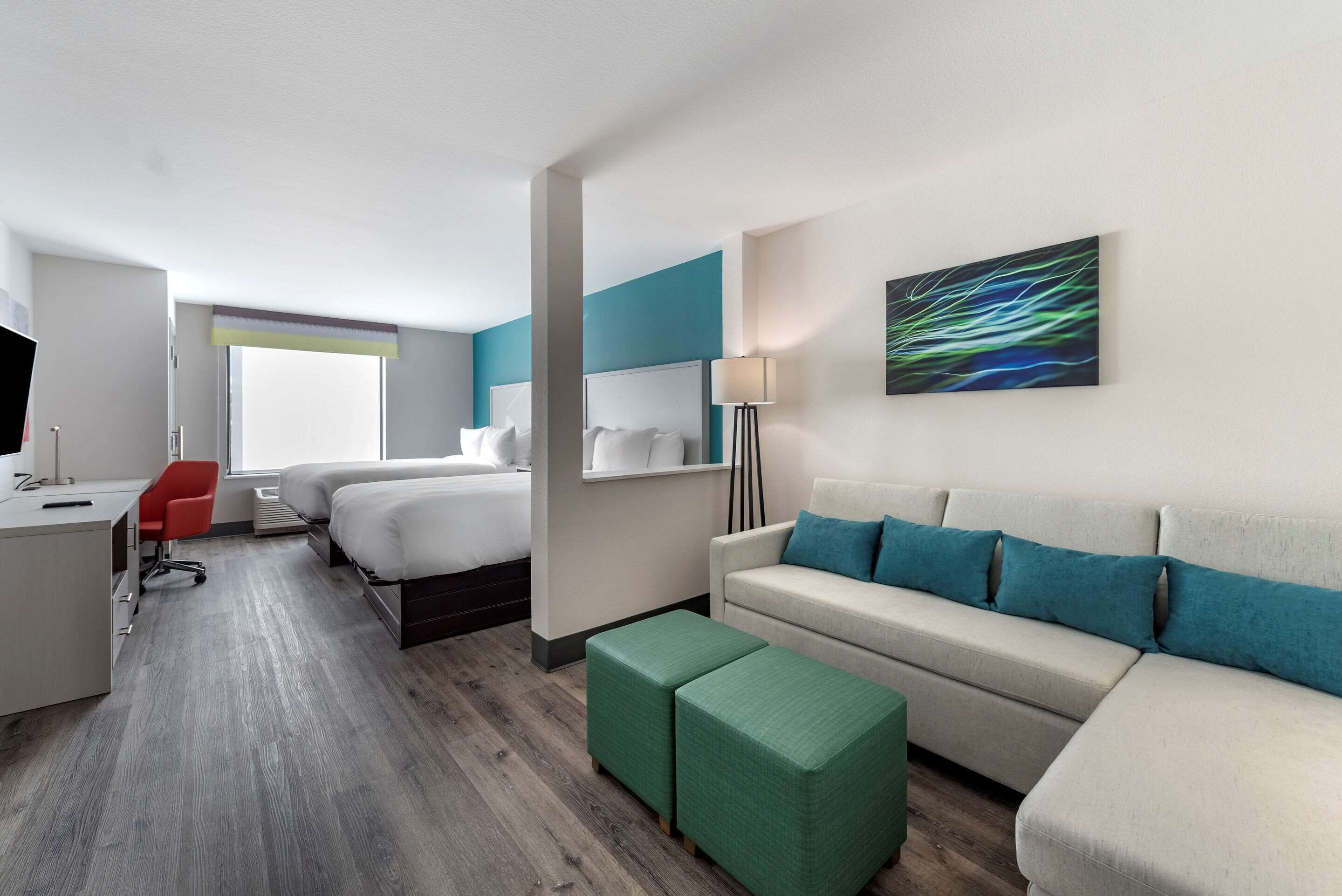 Suite, Multiple Beds, Non Smoking | Desk, laptop workspace, iron/ironing board, free WiFi