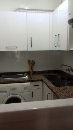 Fridge, stovetop, coffee/tea maker, cookware/dishes/utensils