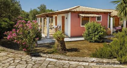 Self catered cottage with large veranda and garden with hammock near the beach.
