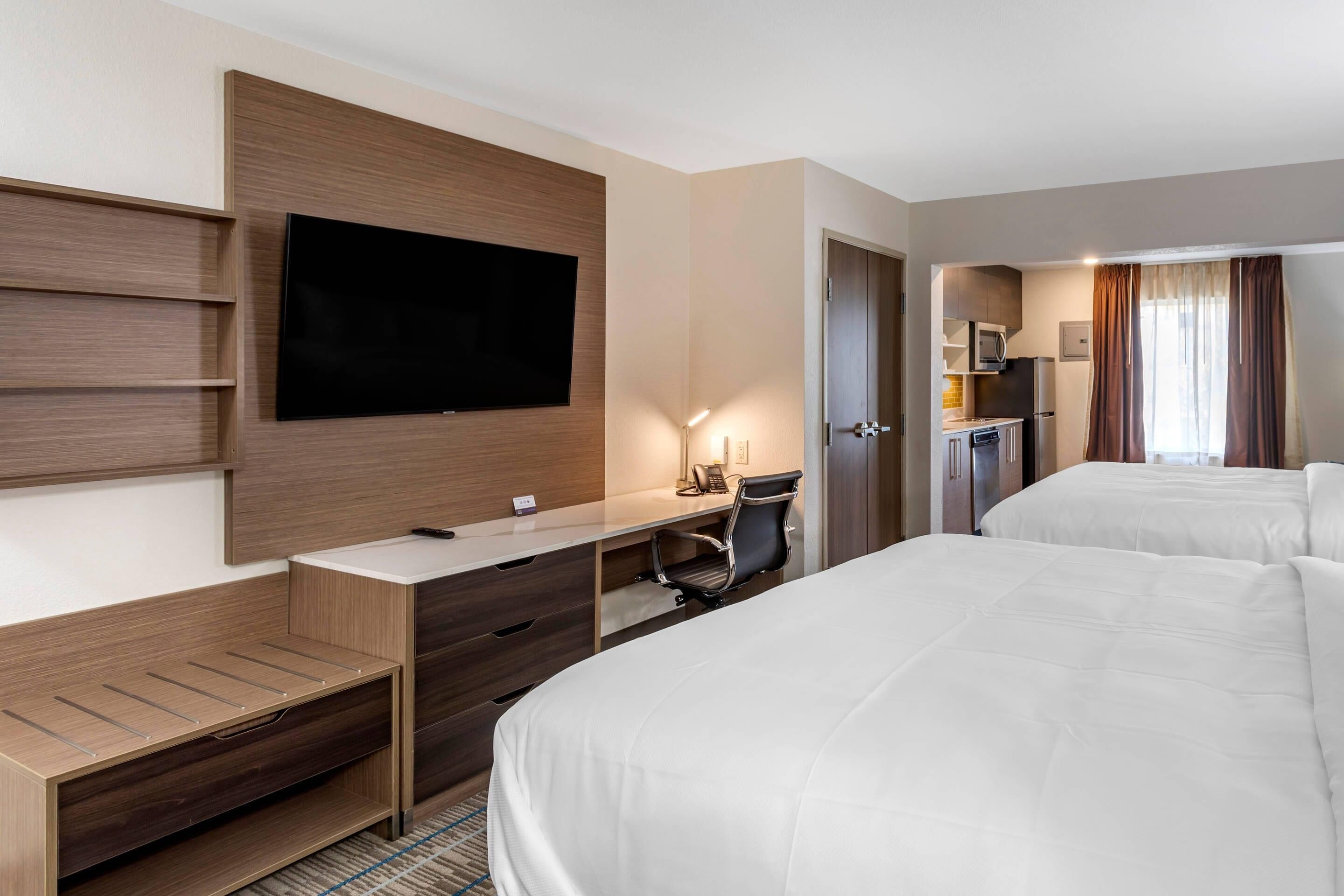 Pillow-top beds, desk, blackout curtains, iron/ironing board