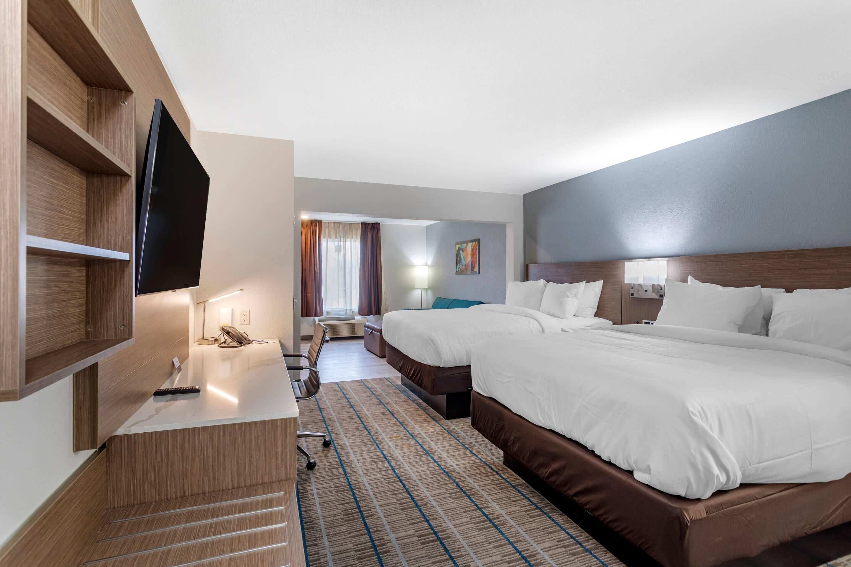 Pillow-top beds, desk, blackout curtains, iron/ironing board