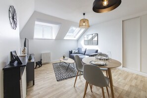 Enjoy meals at the dining table and relax in the comfortable seating area.