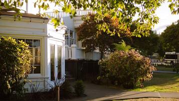 A residential house with a front yard, a garage, and a driveway.