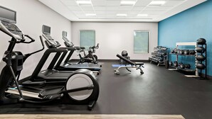 A gym with treadmills, elliptical machines, and a variety of weights and exercise balls. - Hampton Inn Longview (Longview)