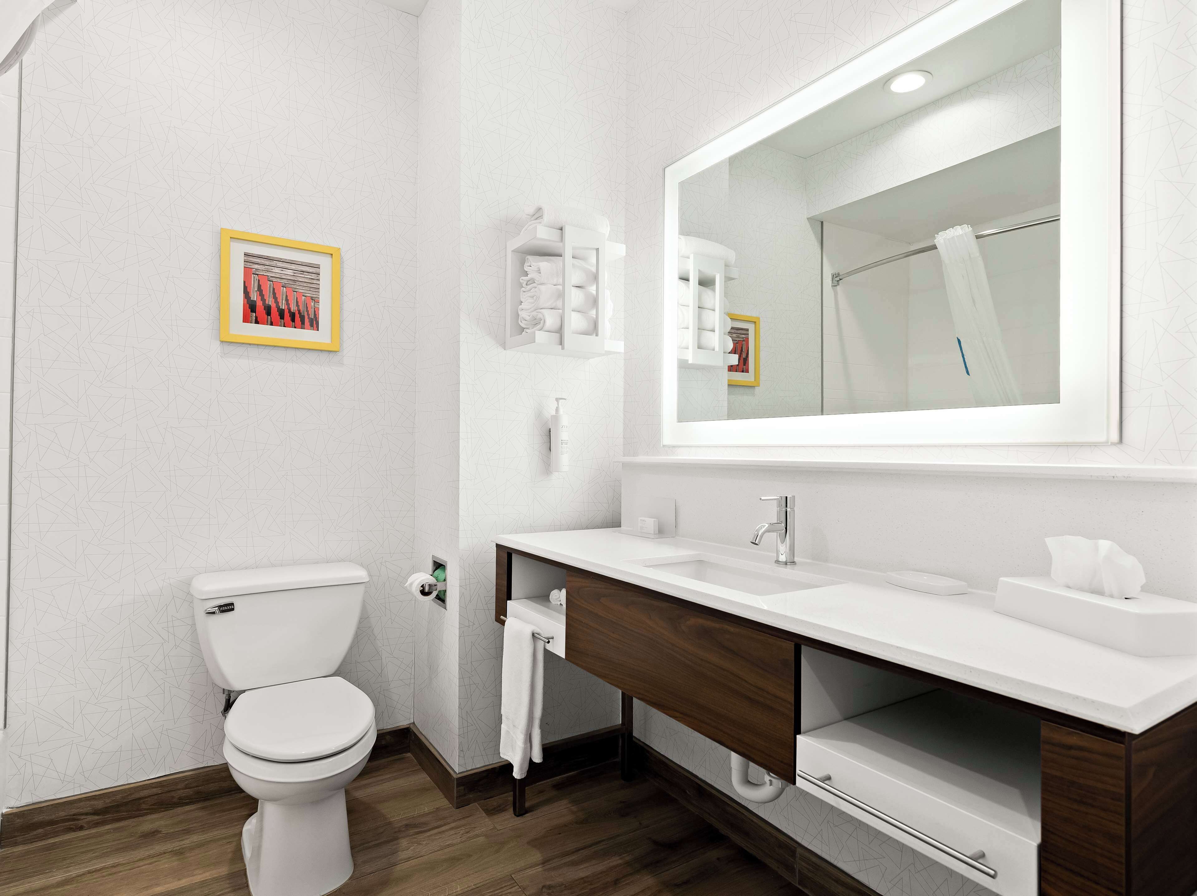 hydromassage showerhead, hair dryer, towels, soap