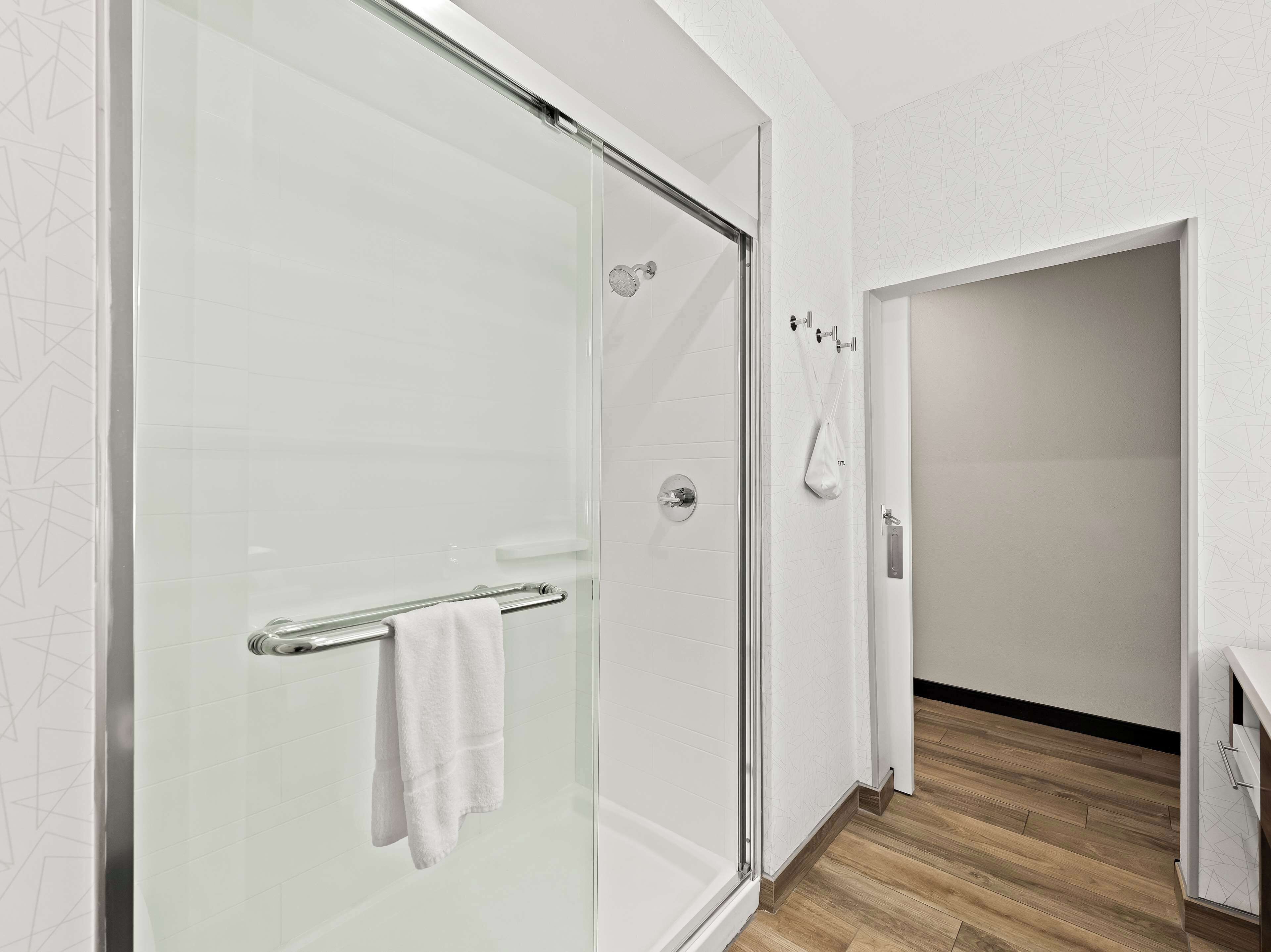 room, 1 king bed, refrigerator & microwave | bathroom | hydromassage showerhead, hair dryer, towels, soap